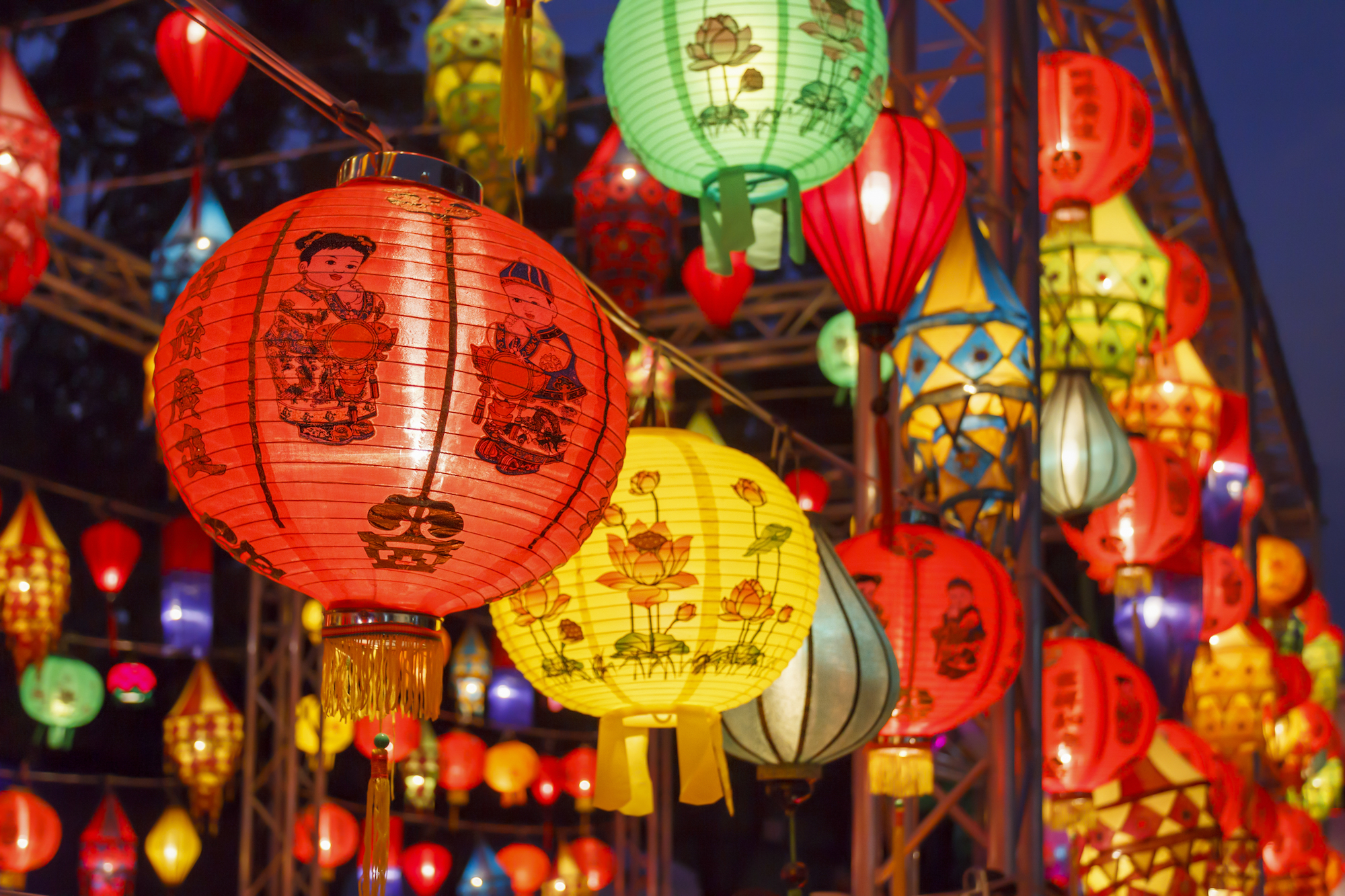 Chinese lanterns are traditionally red, as the color is believed to symbolize warmth, happiness, and good fortune.