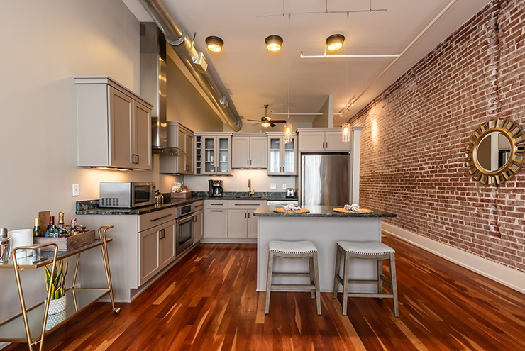 Need a full kitchen and room to entertain? Check into the Restoration.