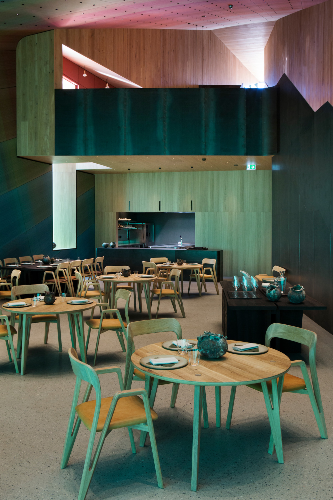 Inside the monolithic structure, the decor creates an ocean-inspired environment.
